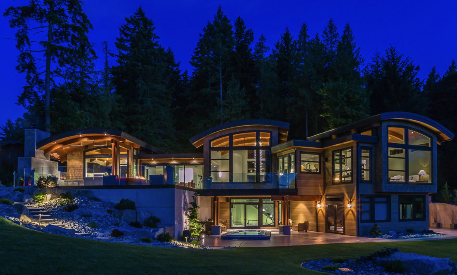 Dramatic curved modern home with extensive Innotech window systems